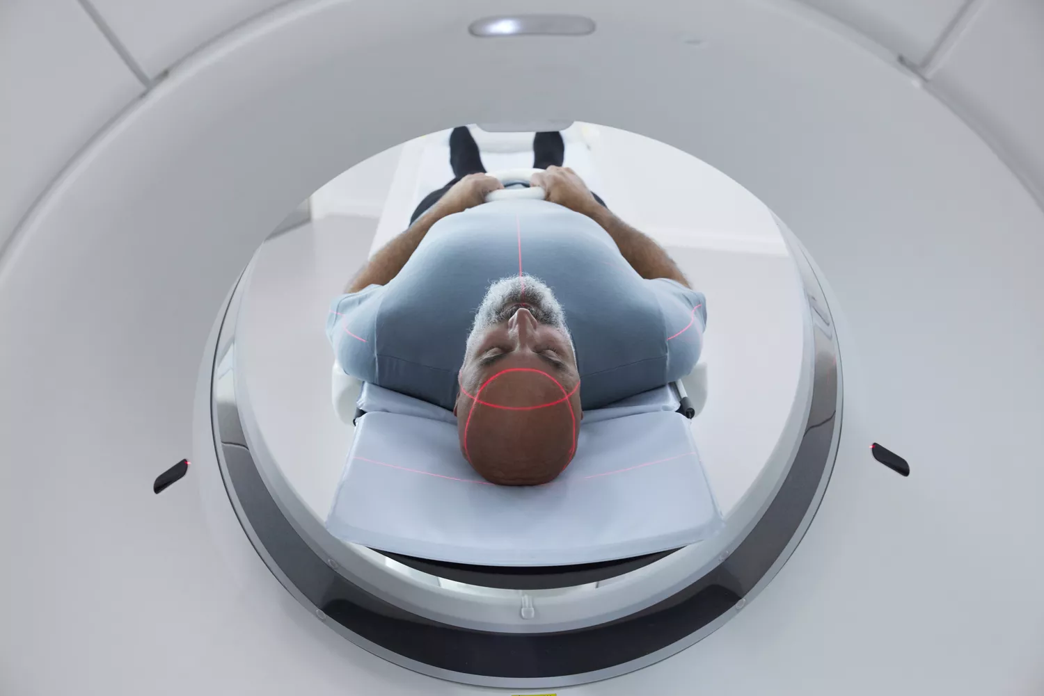 A patient undergoing a brain scan in a clinical setting to investigate cognitive function.