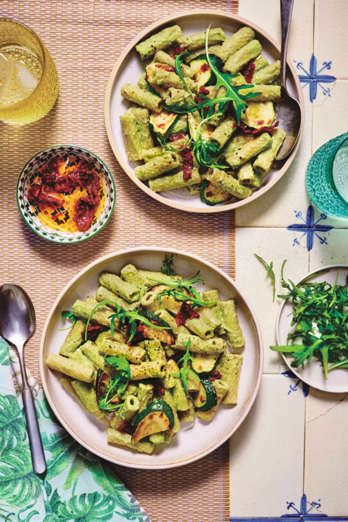 Close-up of creamy Avocado Pesto Pasta illustrating the thick, luscious sauce coating the noodles.
