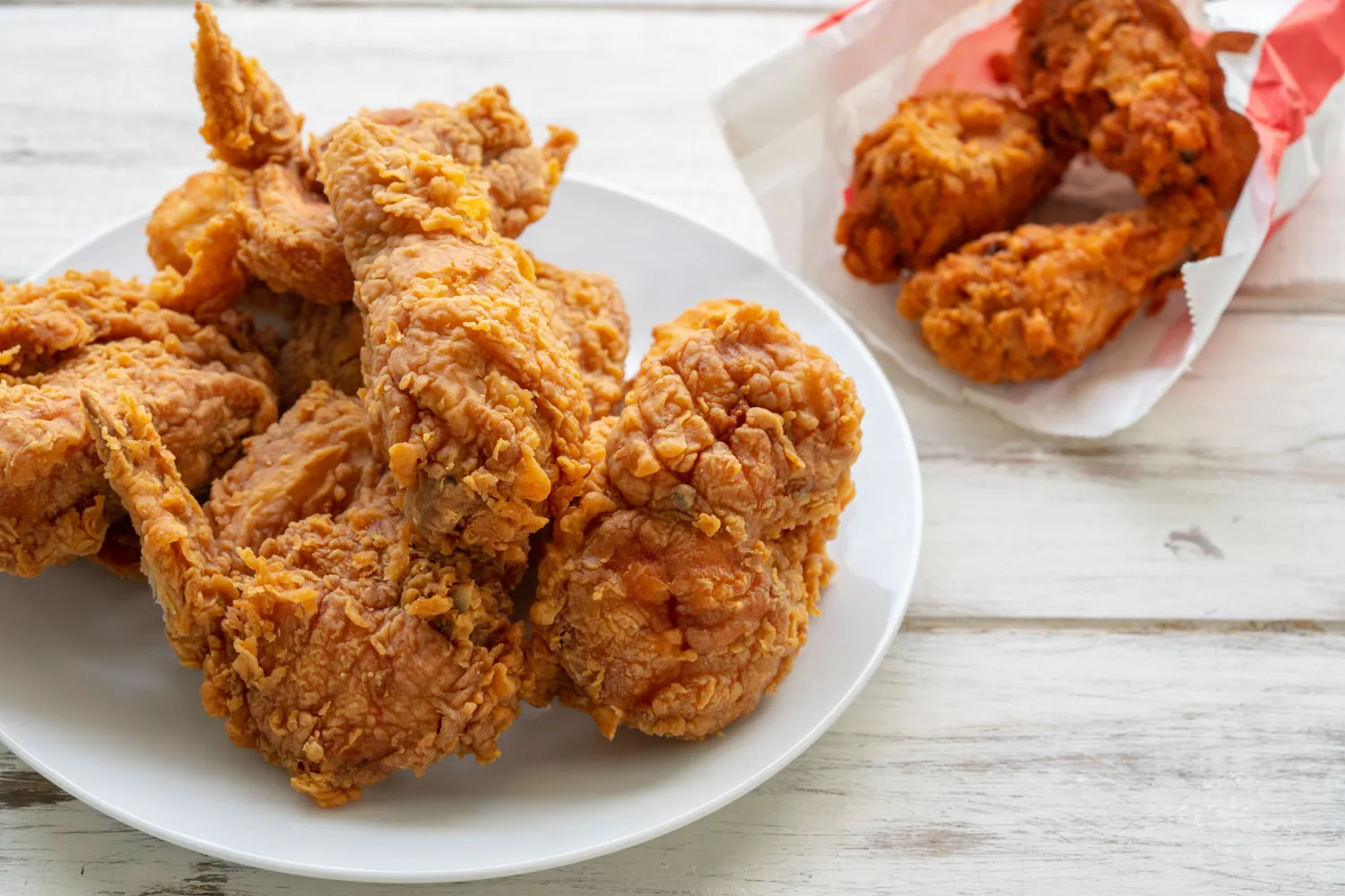 A plate of crispy fried chicken pieces.