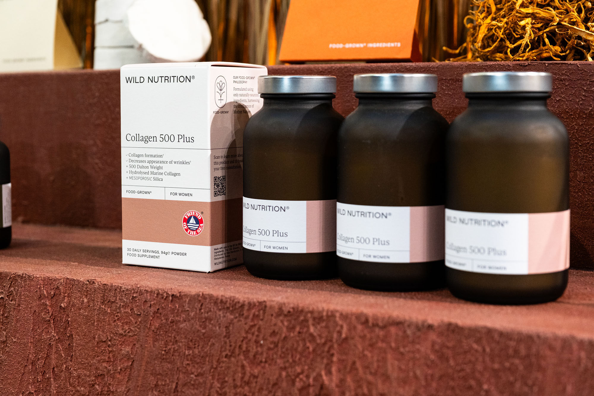 Interior view of the Wild Nutrition wellness takeover at Liberty London showing natural decor elements.