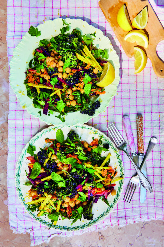 A vibrant veggie-vibes power bowl with shredded beetroot, carrots, and chickpeas.