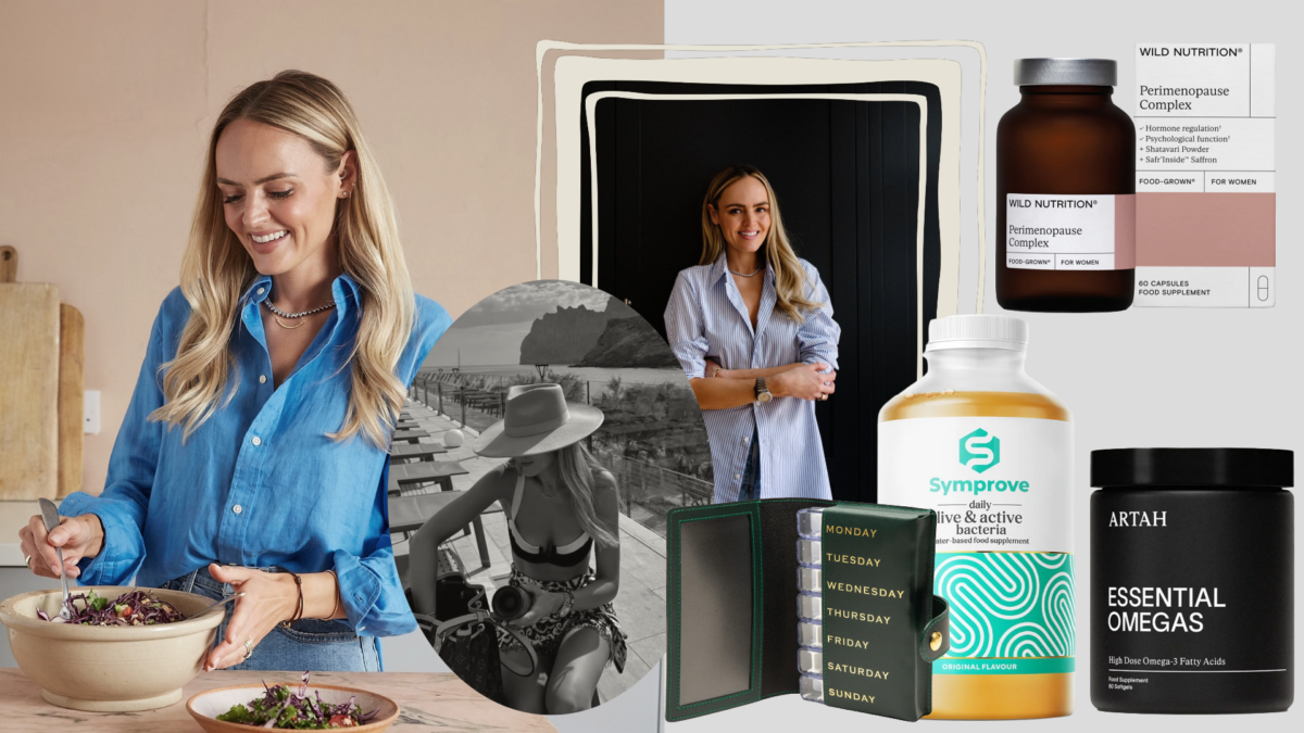A woman in her 40s smiling while organizing her daily supplement routine.