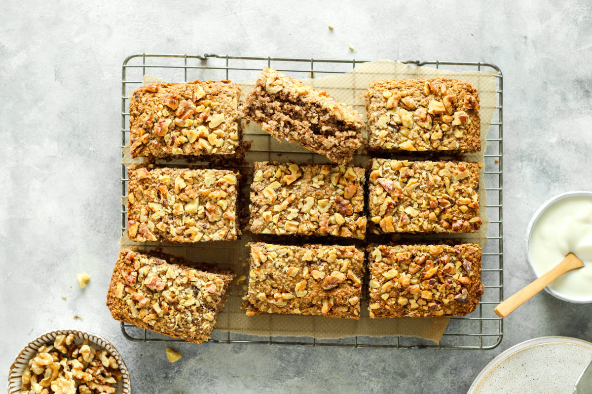Close-up of a walnut and banana breakfast traybake highlighting the crunchy nut topping and fiber-rich oat base.