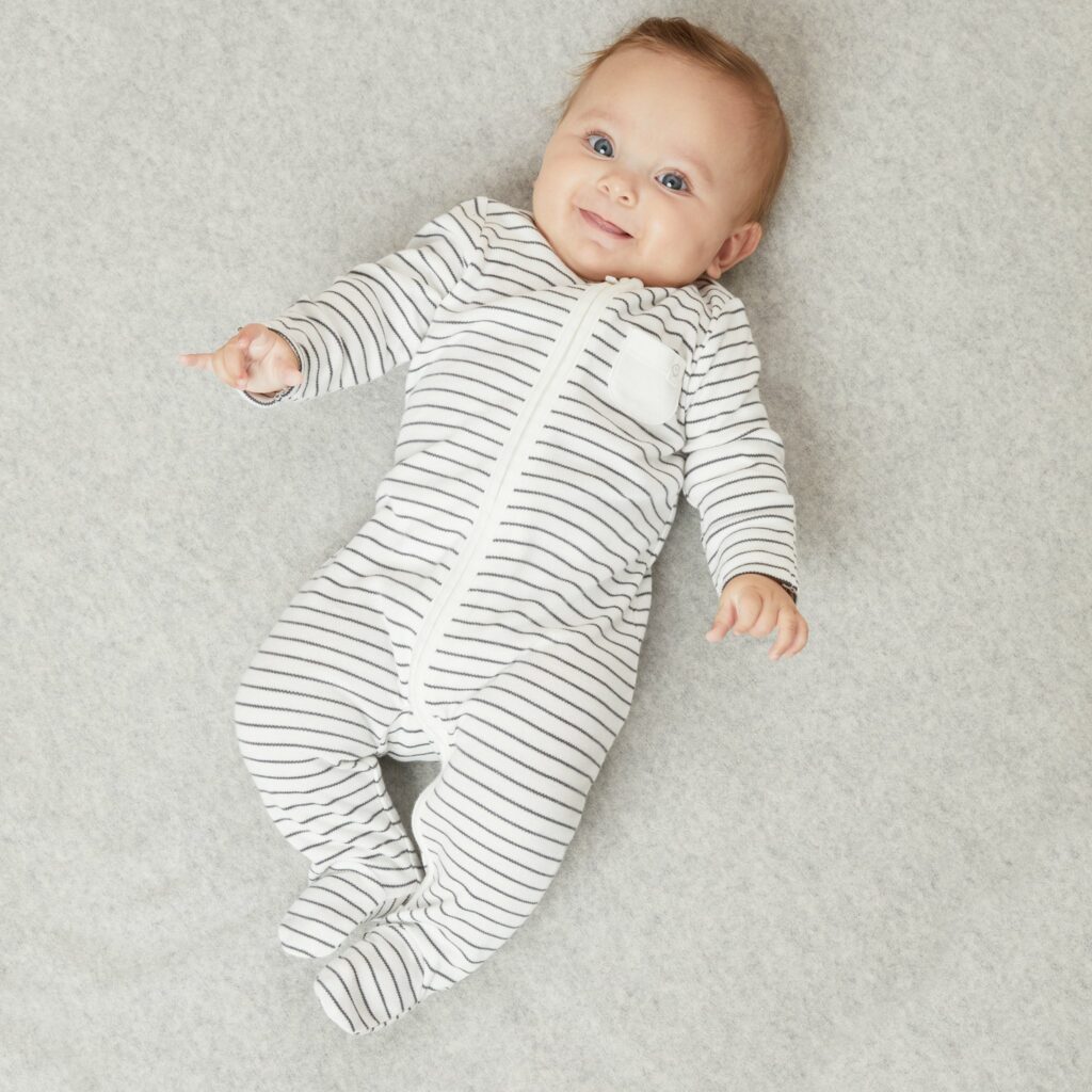 Soft Mori brand baby sleepsuits displayed on a flat surface.