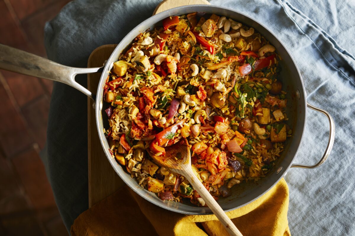 Close-up of vegan kimchi fried rice featuring brown rice, tofu, and aged kimchi.