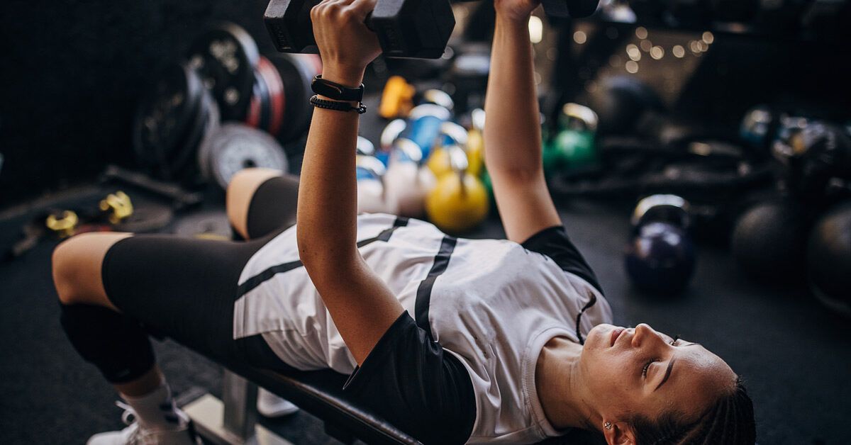 Side profile view showing the proper 91-degree arm positioning during a tricep extension.