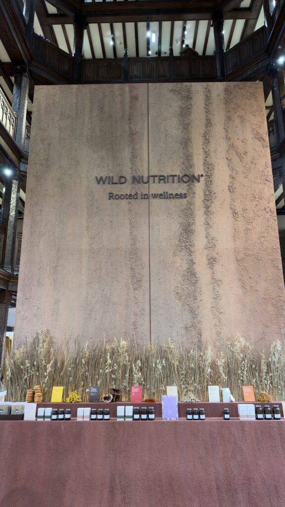 A nutritional therapist engaging in a personalized consultation at the Wild Nutrition pop-up.