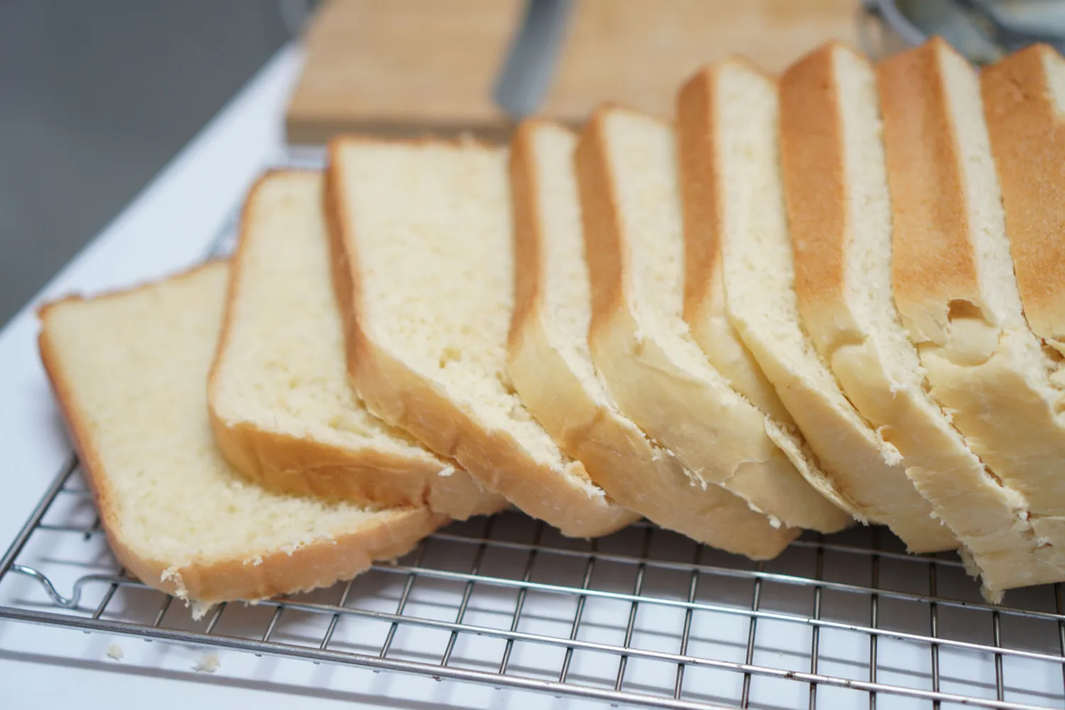 Close-up of several slices of white bread.
