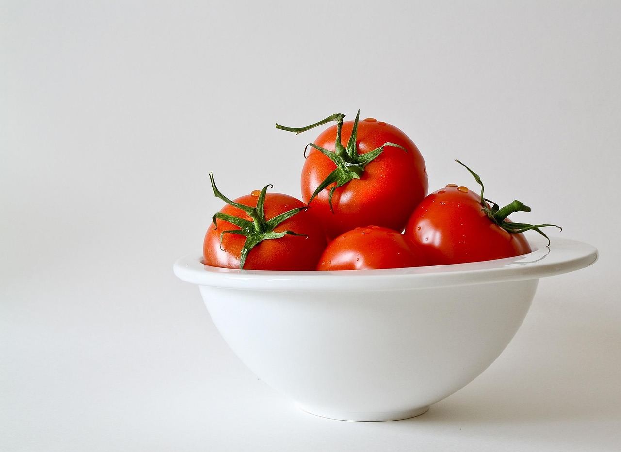 A healthy woman preparing a meal representing metabolic health and balanced blood sugar.