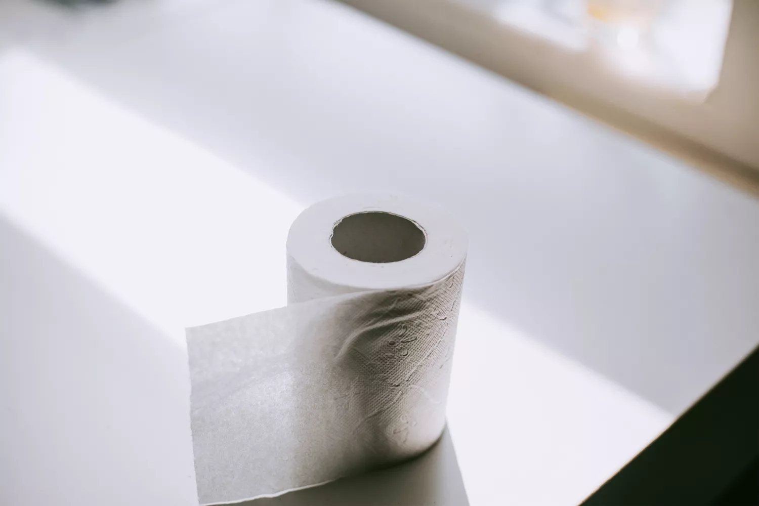 Toilet paper on a counter representing the common gastrointestinal side effects of GLP-1 medications.
