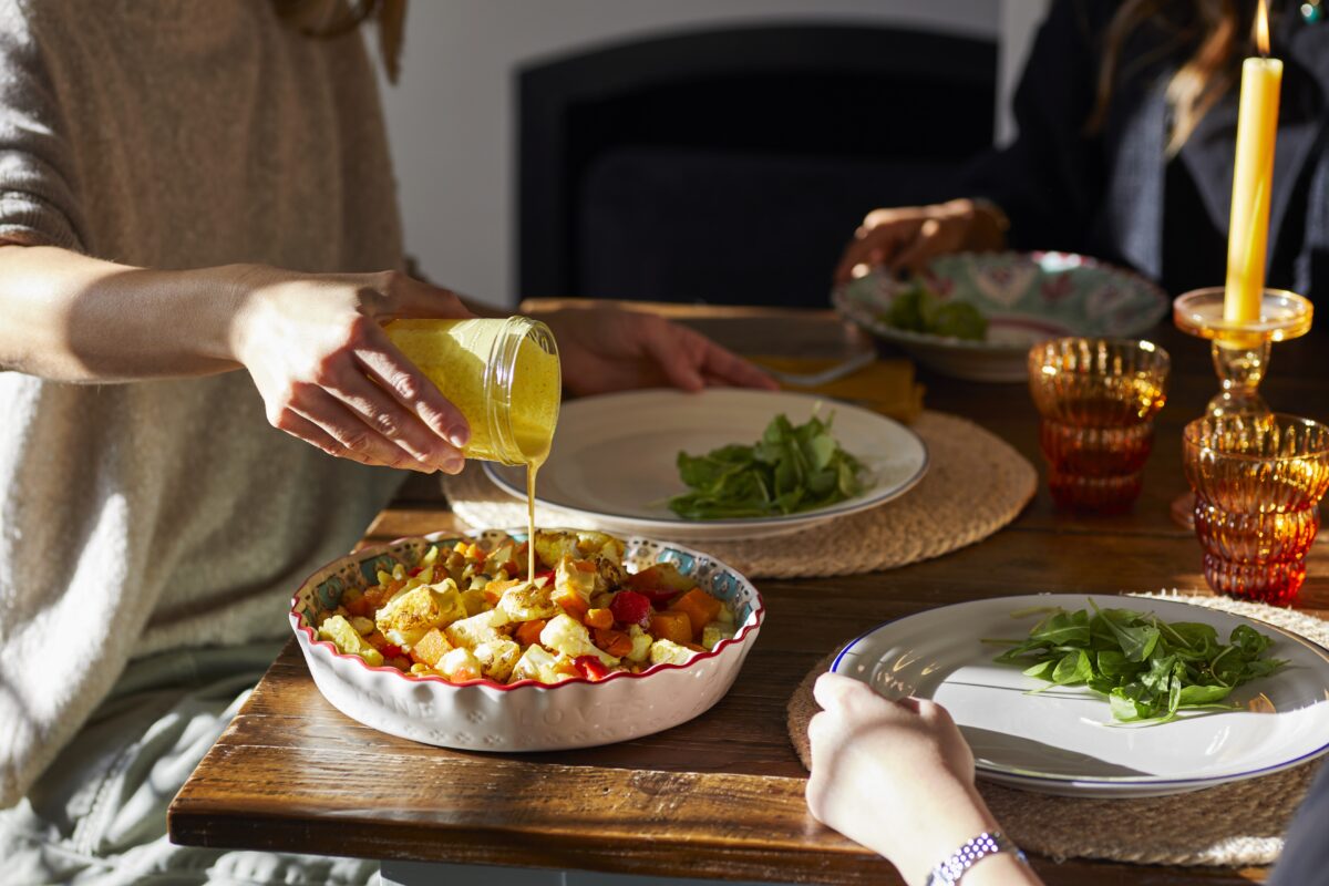 A tray of roasted seasonal vegetables including cauliflower and squash.