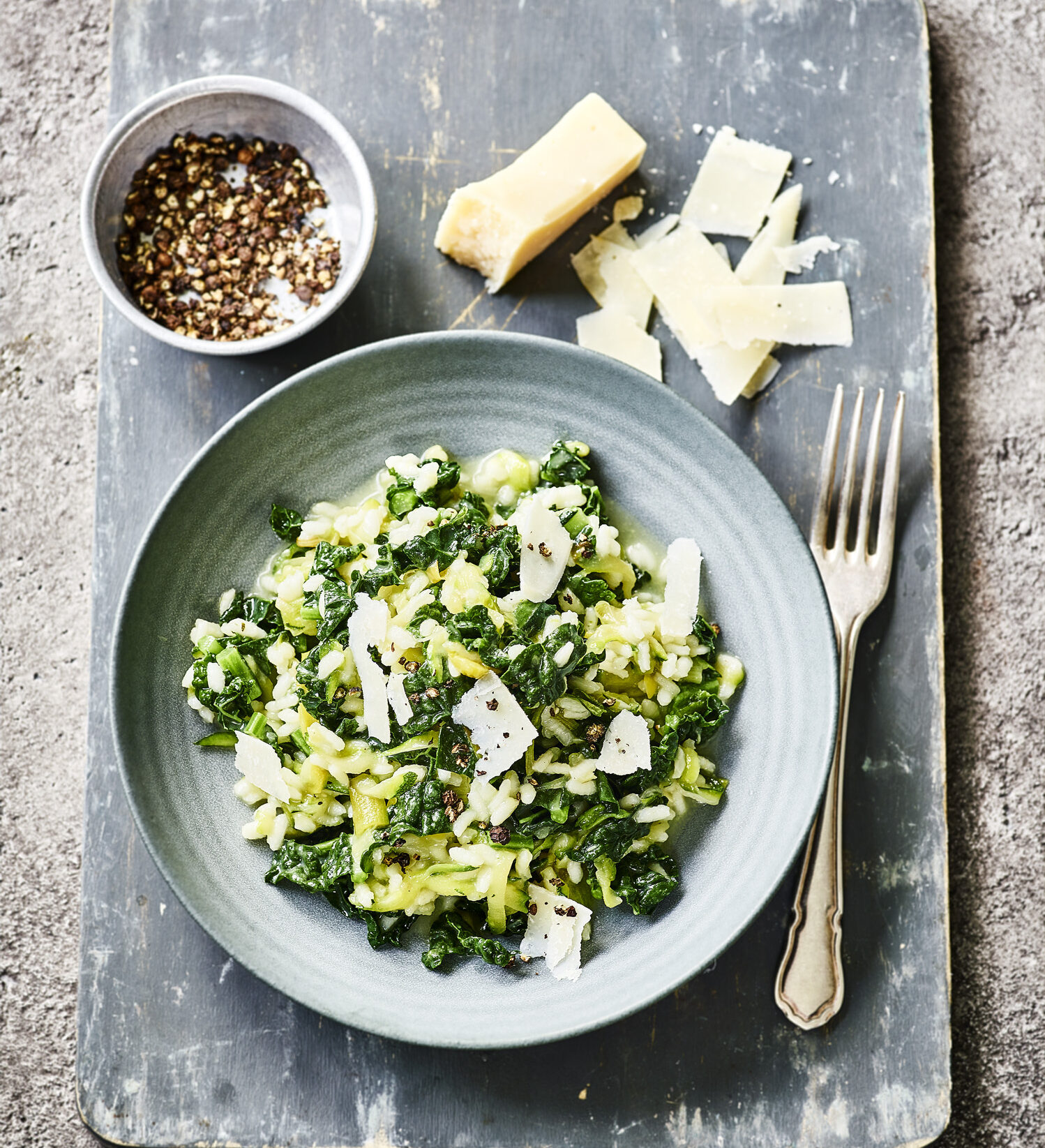 Finished vegan green risotto showcasing a creamy texture and bright green vegetables.